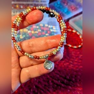 Handmade gold, red and silver BELIEVE charm bracelet